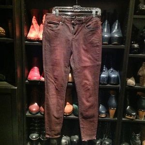 Acid wash burgundy skinny jeans